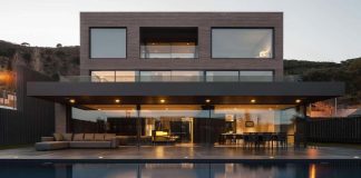 Contemporary home in Barcelona covered in dark brick shaped ceramic