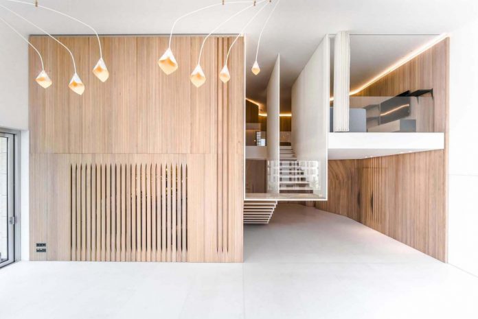 Penthouse Defined By A Cladded Wooden Skin And A Floating