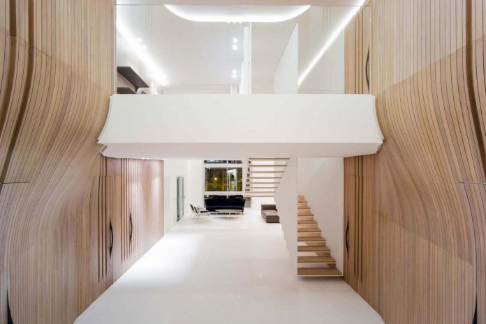 Penthouse Defined By A Cladded Wooden Skin And A Floating