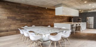 A concrete linear home with a wooden theme interior design find from the floor to the ceiling
