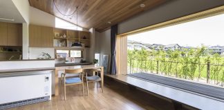 Teto Architects designed a house with a large landscape window open on beautiful rice field in Itoshima