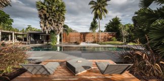 Vacation house surrounded by beautiful Palmyra palms at the meander of the longest river in southern Thailand