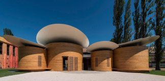 House of music: architecture blends with music and creates this 9 circular music workshops wrapped in oak wood