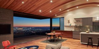 Contemporary conversion of an fire-storm house into a modern home with a curved wood ceiling