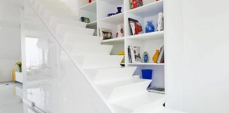 Joyful white apartment in the heart of Budapest with a living green wall and other touches of contrasting colors