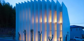 One continuous space with no partitions between rooms covered into 13 gigantic white louvers
