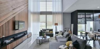 Wil’s 11 Residence: living room with a double volume wood wall feature matched with sheer curtains