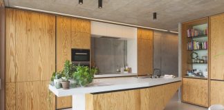 Lighting system helps creating the balance between the industrial and warm elements in the family home