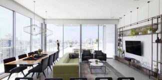 Minimalist design concept where the view remains the main focal point of this penthouse in Holon, Israel