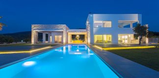 Two storeys villa in Greece with large openings on both levels