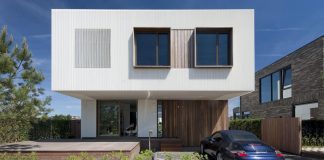 Serene exterior contrasts highly to the rough inside of this modern two-storey residence located in Amsterdam