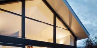 Extension of a building into a two-level, contemporary house which has a mix of private, social and work spaces