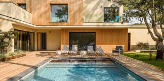 Modern wooden residence surrounded by greenery