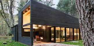 2-bedroom wooded residence quietly blends into the surrounding forest on the banks of the White River