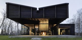 Contemporary house is an assemblage of three offset structures that play off each other