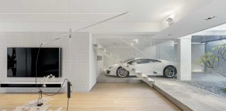 Contemporary white walls with light wooden flooring make this Hong Kong house warm and inviting