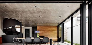 Brick, wood and black & white touches define this contemporary home by COSO Architecture