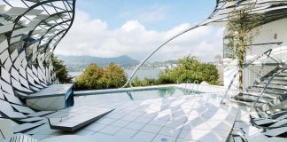 Steel structure similar to a cocoon all around a swimming pool by heri&salli
